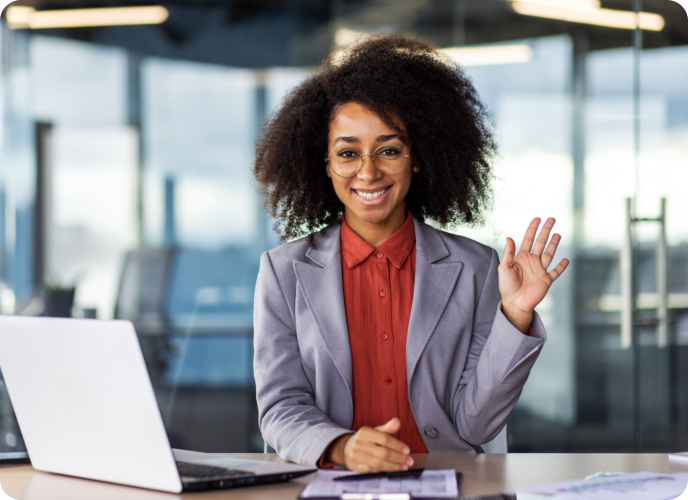 Woman waving at the camera