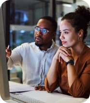 Two people looking at the computer