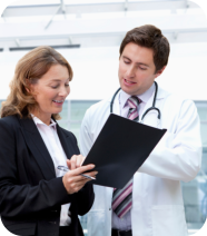 Two people looking at the document