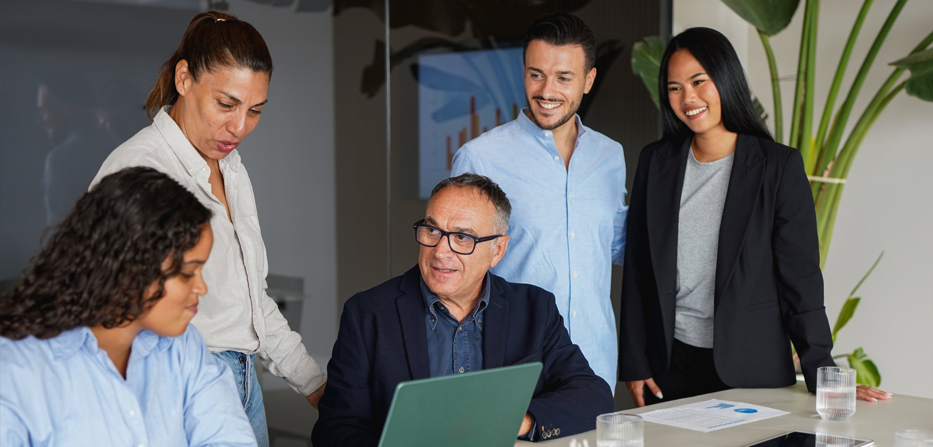 Multiracial business people working together inside modern office sharing ideas