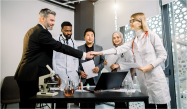 Pharmaceutical Workers Having Meeting In Modern Lab With Equipment