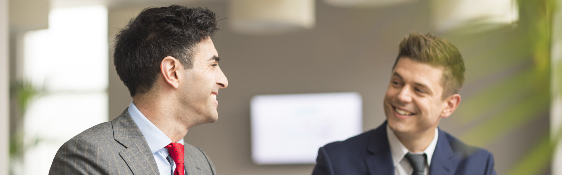 Two businessmen meeting in boardroom