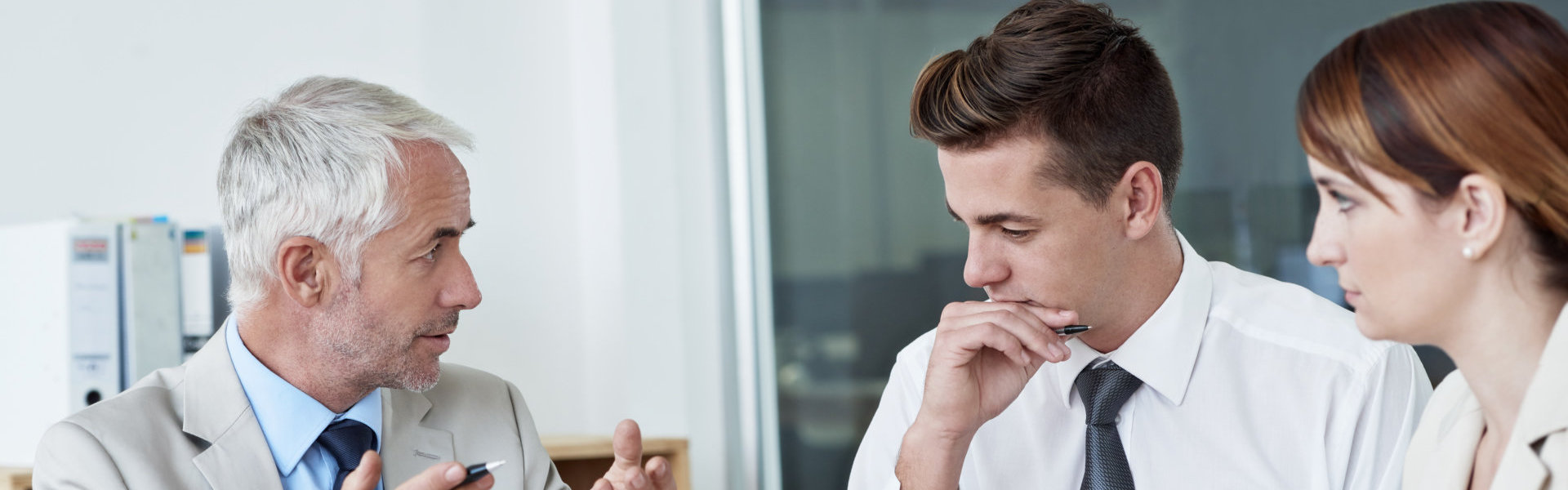 Three people in meeting