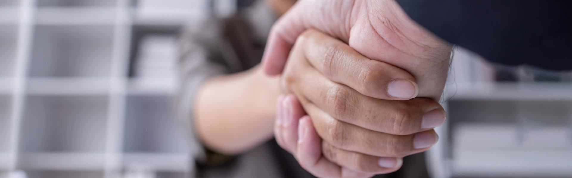 Close up shot of people doing handshake