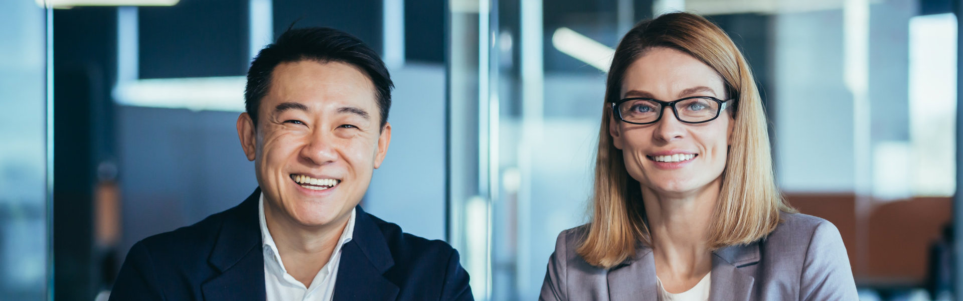 Two people smiling at the camera