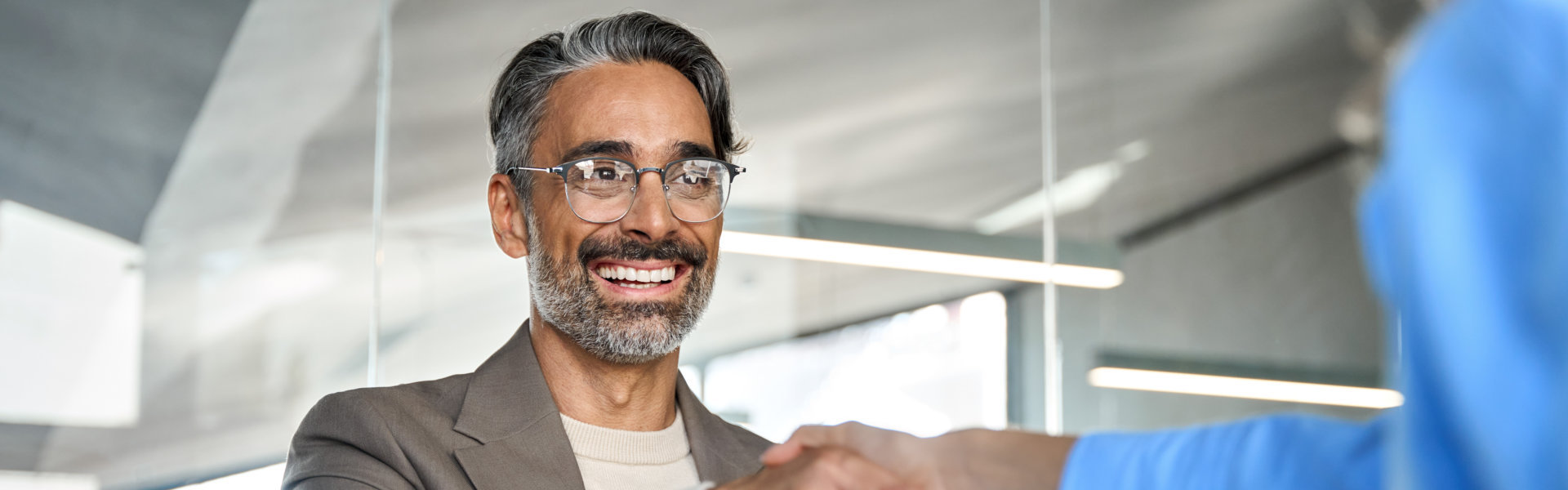 Happy businessman hiring recruit