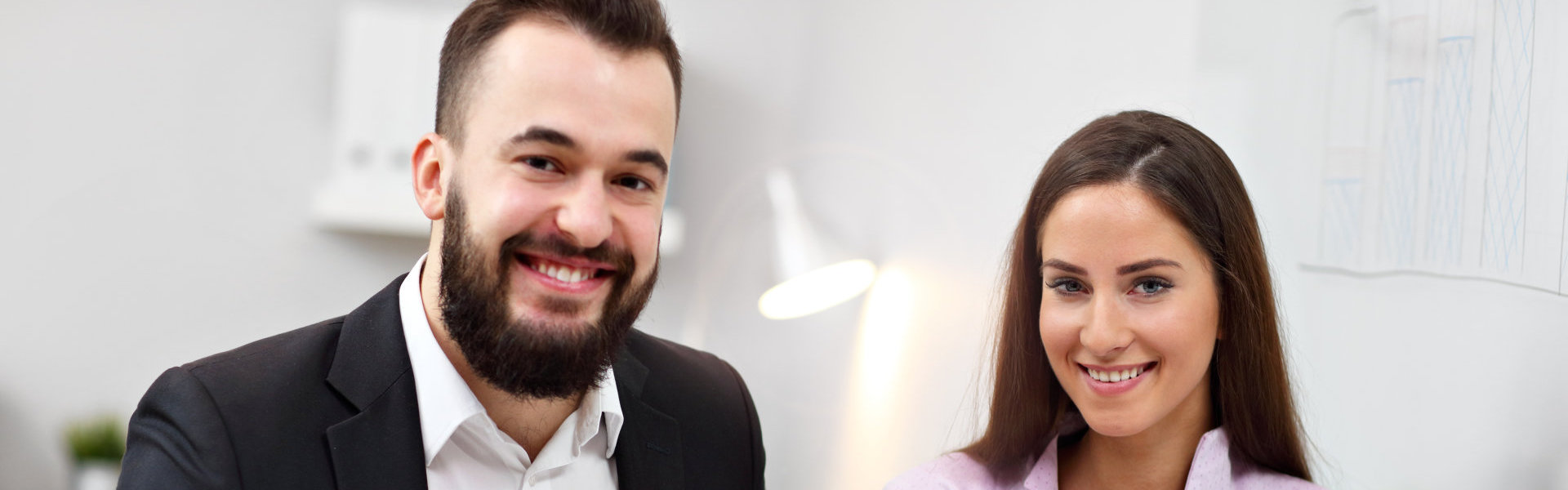 Two people smilnig at the camera